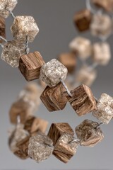 Close-up of wooden and beige cube necklace