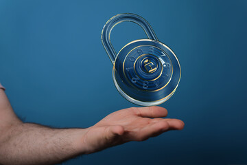 Hand holding a digital padlock, symbolizing online security and data protection.
