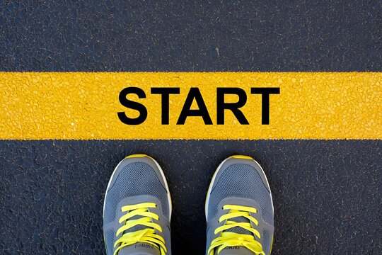 Start line concept with running shoes for motivation and beginning new journey or challenge