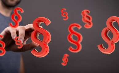 Abstract image of a hand interacting with floating paragraph symbols, ideal for legal or...