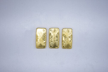 Gold bars, gold color, containing 96.5 percent gold.
