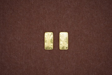 Gold bars, gold color, containing 96.5 percent gold.