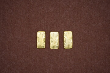 Gold bars, gold color, containing 96.5 percent gold.