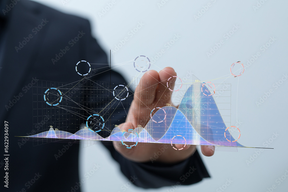 Poster stock photo of a businessman interacting with a holographic projection of data graphs and charts, il