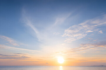 Morning sea panorama with gentle dawn glow and feathered cirrus clouds offering a clean minimal background for branding and ads