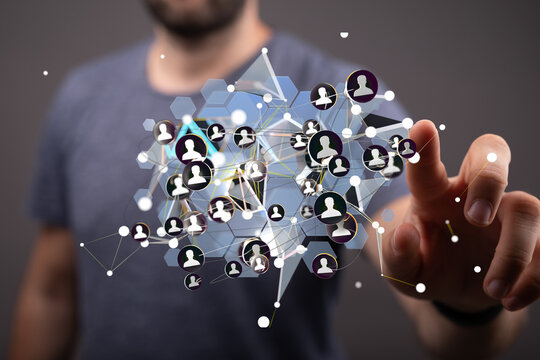 Image of a person interacting with a digital network visualization, showing connections and social media. - Powered by Adobe