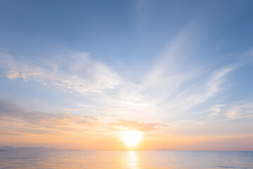 Evening ocean view with warm sky gradients above a flat horizon delivering serene negative space for presentations and hero images