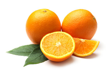 Whole, cut oranges and green leaves isolated on white