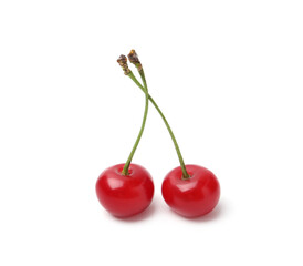Two fresh ripe cherries isolated on white