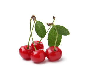 Fresh ripe cherries with green leaves isolated on white