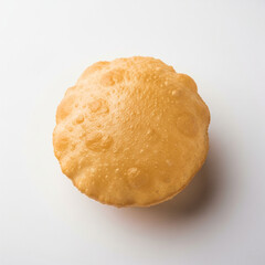 Top view of a single puffed puri isolated on white
