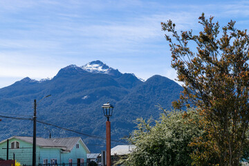 Snow capped mountain dominating the skyline of chilean patagonia
