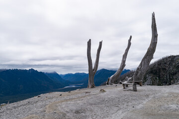 Desolate bench overlooking majestic patagonia mountain valley in chile