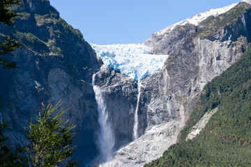 Queulat hanging glacier generating waterfalls in patagonia chile