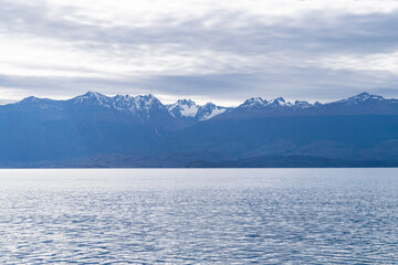Snowy andes mountains reflecting on lake general carrera in chile patagonia