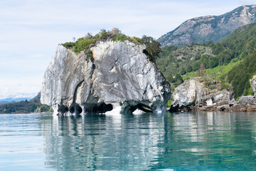 Marble caves reflecting on turquoise water in general carrera lake, chile patagonia