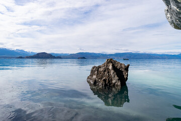 Rock reflecting in the general carrera lake in chile patagonia
