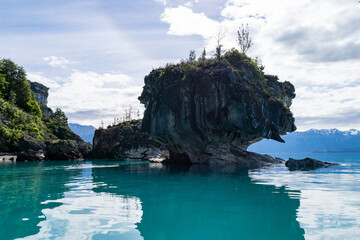 Marble caves reflecting on turquoise water in general carrera lake, chile patagonia