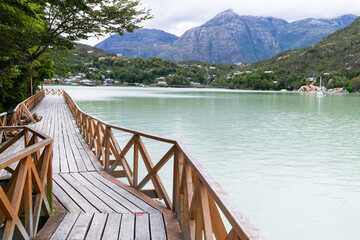 Wooden pier stretching into the serene waters of patagonia, chile