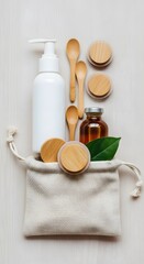 Flat lay of toiletries and wooden utensils in a cloth bag set