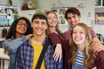 Portrait of happy smiling multiethnic classmates at high school