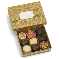 eco friendly box with bamboo pattern and sweets inside, flat lay ,isolated on white background
