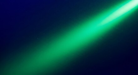 Bright green light beam shining in the dark with subtle stars