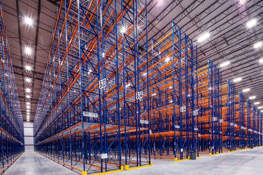 Interior of modern warehouse with empty racking system design for cold storage