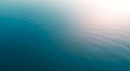 Obraz premium Abstract blue water surface with gentle ripples and soft light