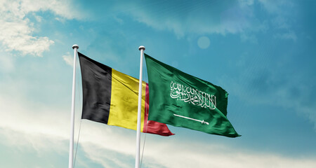 Belgium and Saudi Arabia friendship flags are waving in the sky. Two country flag for agreement or deal. Belgium KSA national flag for commitment.