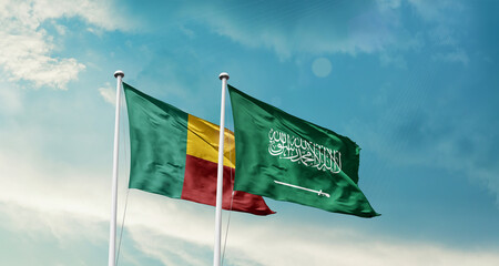 Benin and Saudi Arabia friendship flags are waving in the sky. Two country flag for agreement or deal. Benin KSA national flag for commitment.