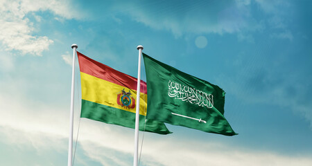 Bolivia and Saudi Arabia friendship flags are waving in the sky. Two country flag for agreement or deal. Bolivia KSA national flag for commitment.