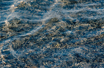 pattern of blue ocean water with small waves