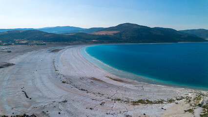 The tranquil beauty of Salda Lake - Turkey with its crystal clear turquoise waters and stunning surrounding landscapes is a mesmerizing sight to behold.