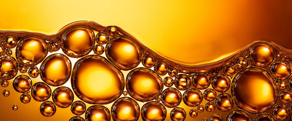 Yellow and orange bubbles, drops of oil in water, olive oil for cooking background.	