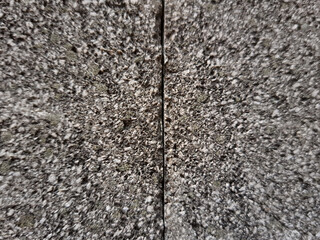 Close up of grey granite stone texture with dark veins and white color blend. Natural grey stone...