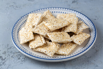 Turkish Citir Helva Susame crocan dessert susamli krokan on black rock plate