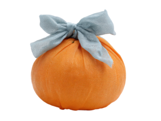 Orange sphere wrapped in light blue fabric;  bow tied