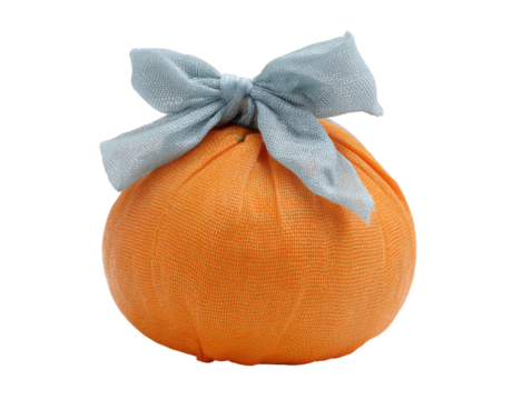 Orange sphere wrapped in light blue fabric;  bow tied
