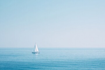 Sailing boat gliding through tranquil blue waters under clear sk