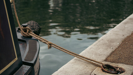 Tranquil river scene with boat nose on water during early morning light