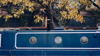 Close up of vintage boat window showing nautical detail and texture of old vessel