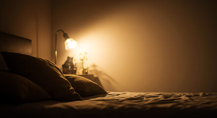 Cozy Bedroom Scene Illuminated by Soft Lamp Light at Night