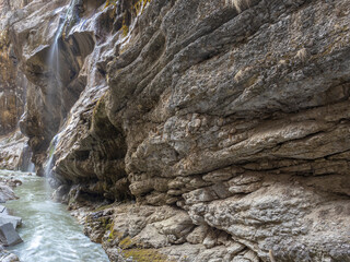 Chegem waterfalls in the mountain gorge of Kabardino-Balkaria. Smooth rocks in the mountains as a result of the descent of water from the peaks. Mountain river.