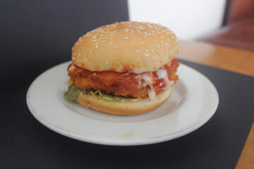 chicken burger on plate with vegetable and fried chicken katsu