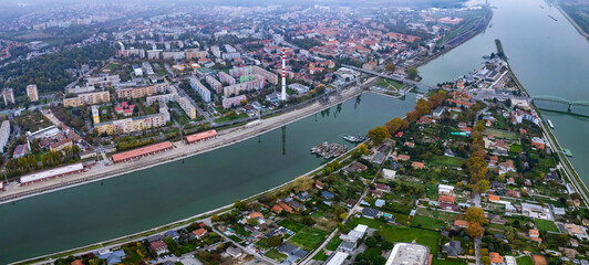  Aerial wide view around the city Komárno, Slovakia on a cloudy autumn day.