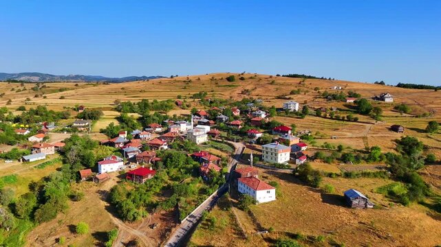 Aerial 4K drone footage of Kurtlu Village in Boyabat, Sinop. Scenic rural landscape with traditional houses, rolling hills, and peaceful countryside, perfect for travel and nature projects. Blacksea