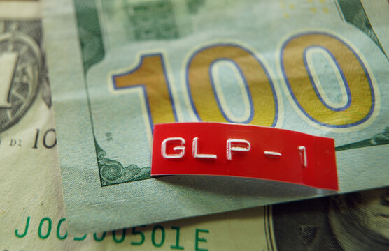 GLP-1 label on a US hundred dollar bill