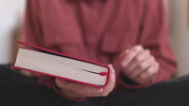 woman with a book in her hands. girl closes a book. pleasure from reading. girl reads.