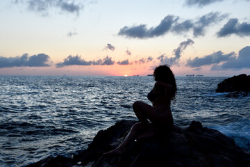 silhouette of a woman on the beach
